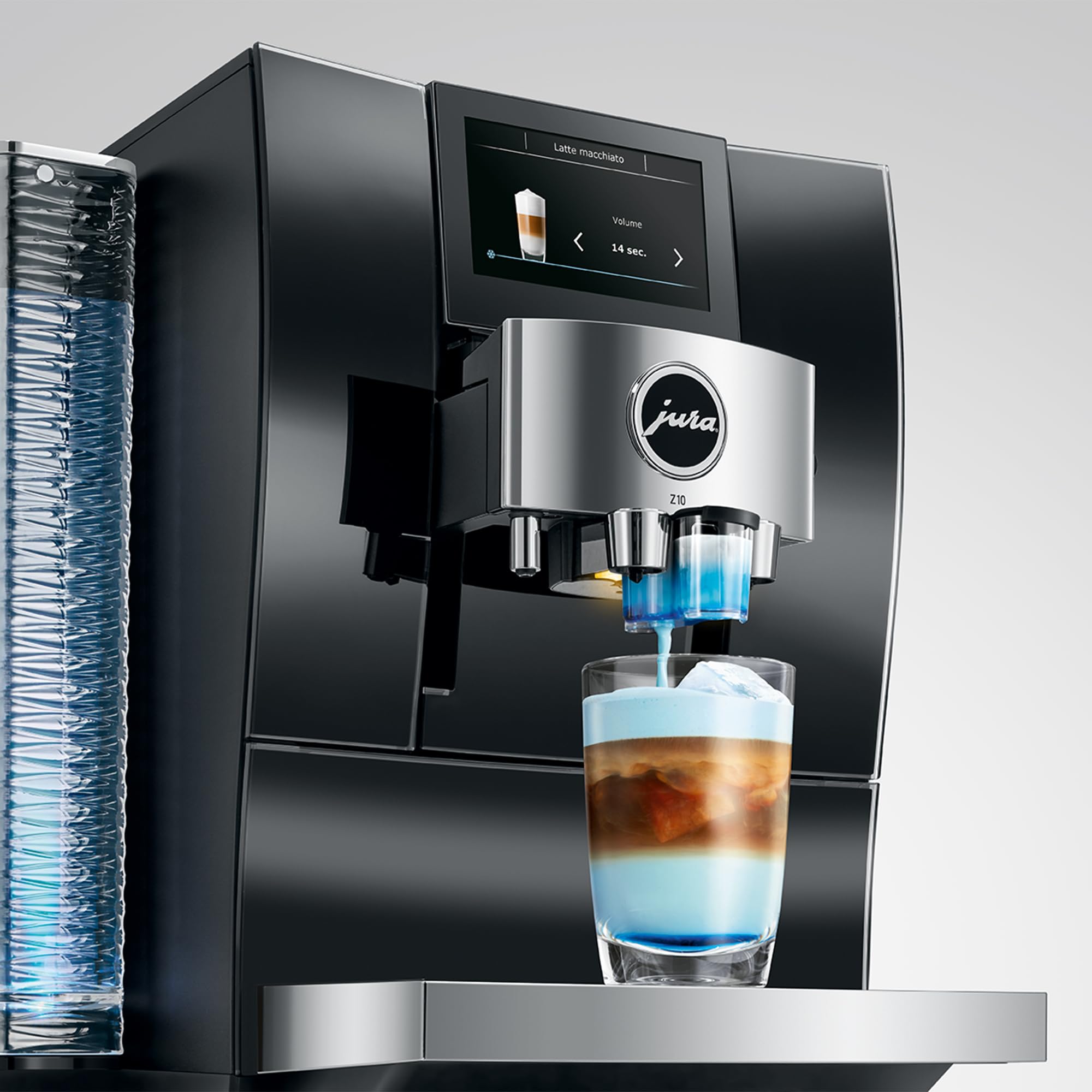 Jura coffee machine dispensing a layered drink into a glass with a clear background