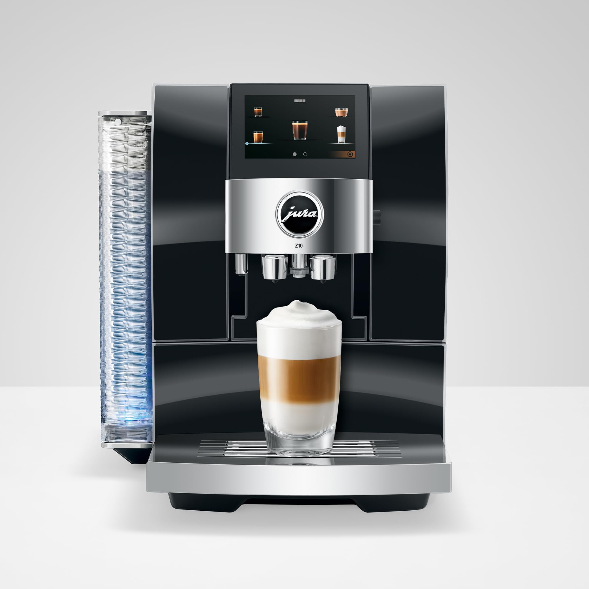 Jura coffee machine with a glass of layered coffee on a white background