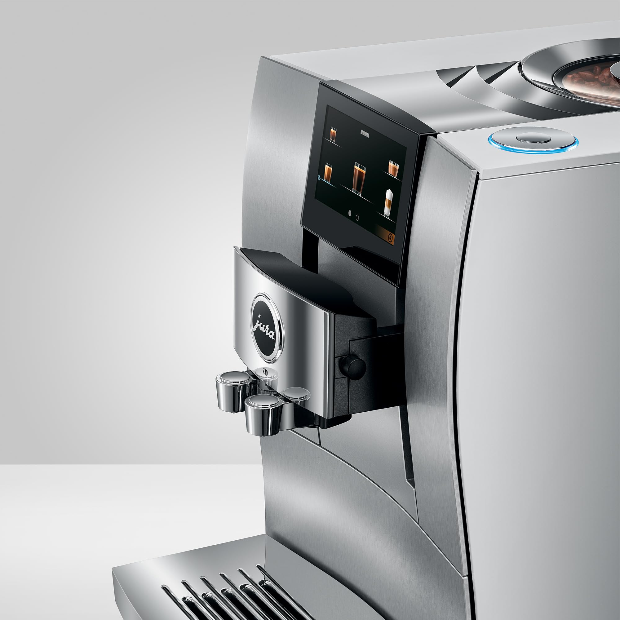 Silver coffee machine with digital display on a white background