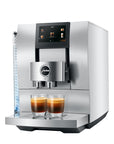 Aluminum White Jura espresso machine with two creamy coffees in glass cups on stand displayed on a white background