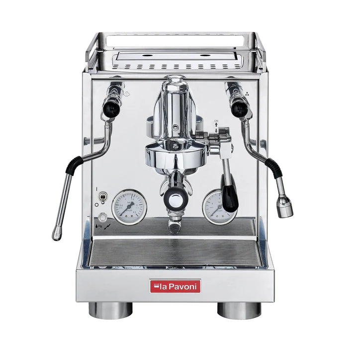 Front view of a professional espresso machine by la Pavoni, featuring a polished stainless steel body, two analog pressure gauges, a central portafilter holder, and a red brand logo plate on the front.