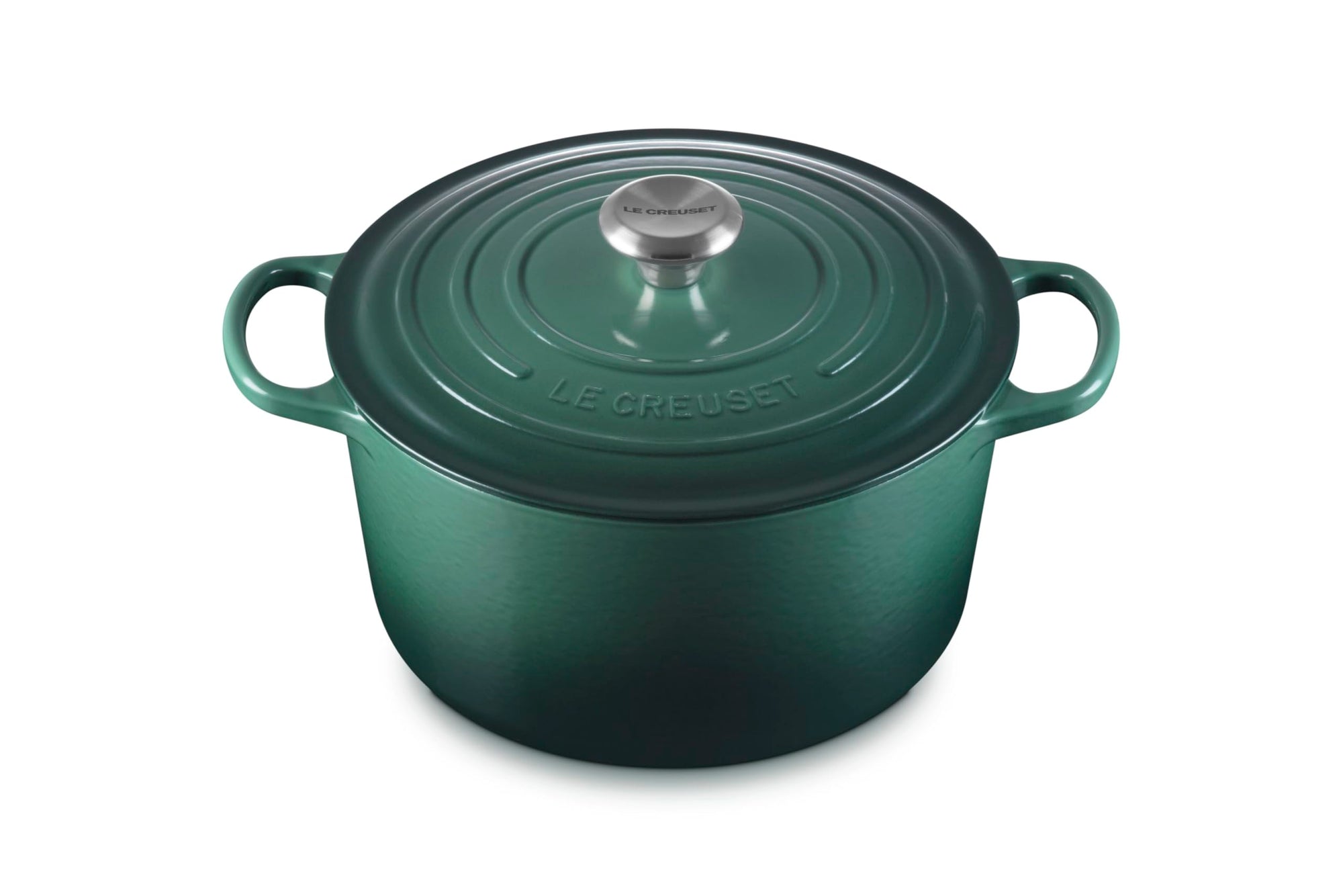 Green cast iron cookware pot with lid on a white background