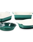 Four-piece ceramic baking dish set in Artichaut, including square, rectangular, round scalloped, and oval baking dishes, shown on a white background.