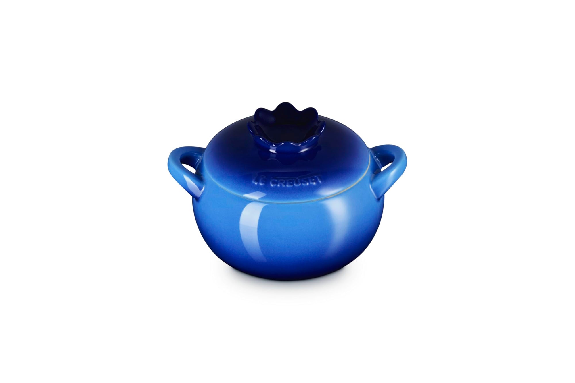 Blue ceramic pot with lid that looks like a blueberry on a white background