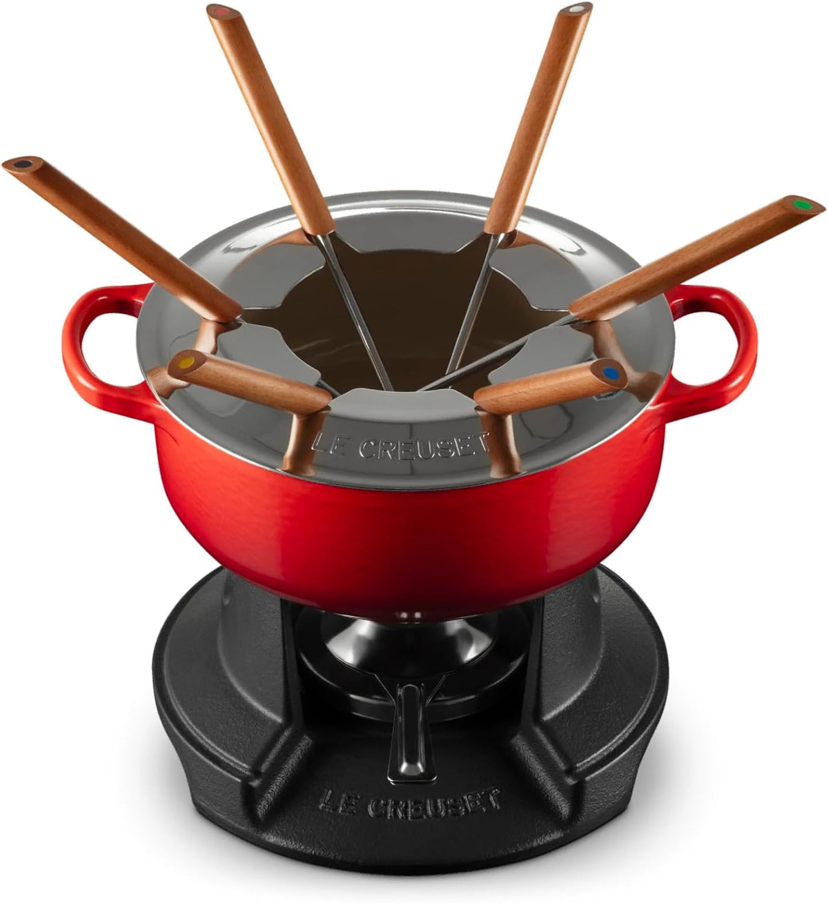 Le Creuset fondue set with a red enameled pot, black burner base, and six wooden-handled forks on a white background.