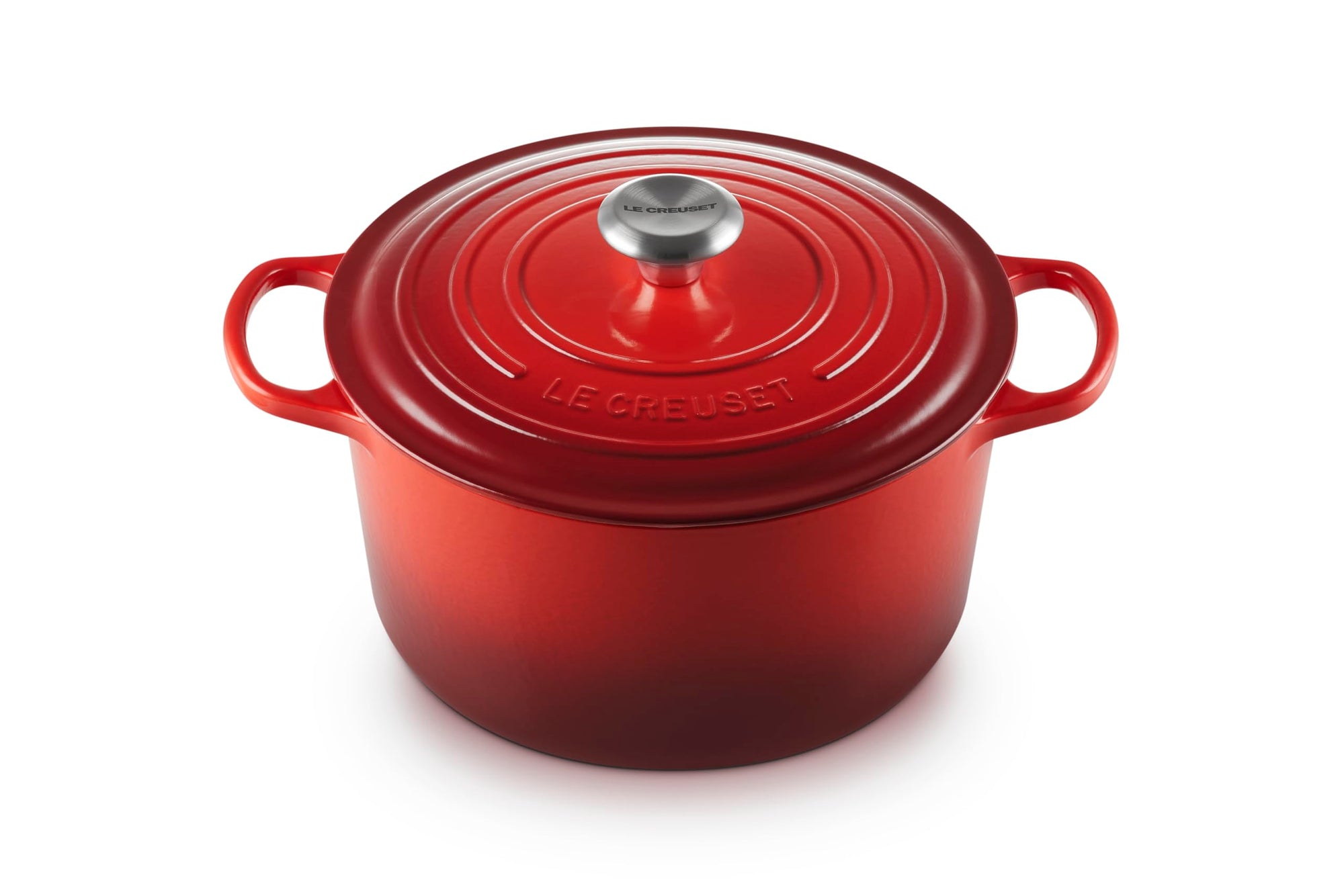 Red Le Creuset Dutch oven on a white background