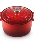 Red Le Creuset Dutch oven on a white background