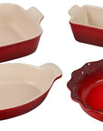 Set of 4 cerise Le Creuset Stoneware Heritage Bakeware set displayed on a white background
