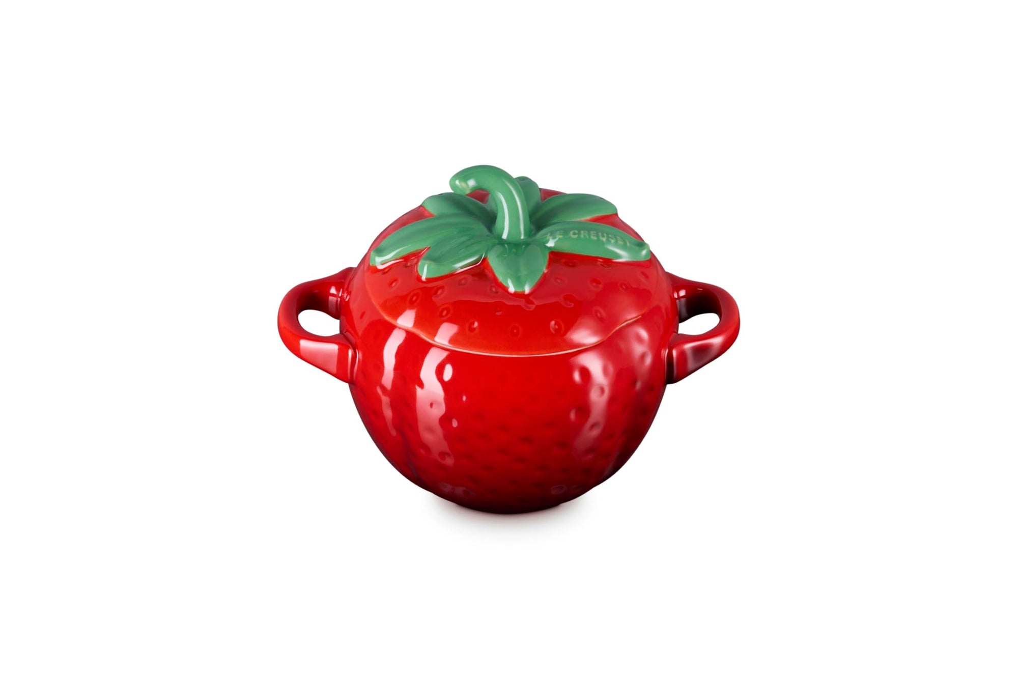 Red ceramic pot shaped like a strawberry with green stem lid on a white background