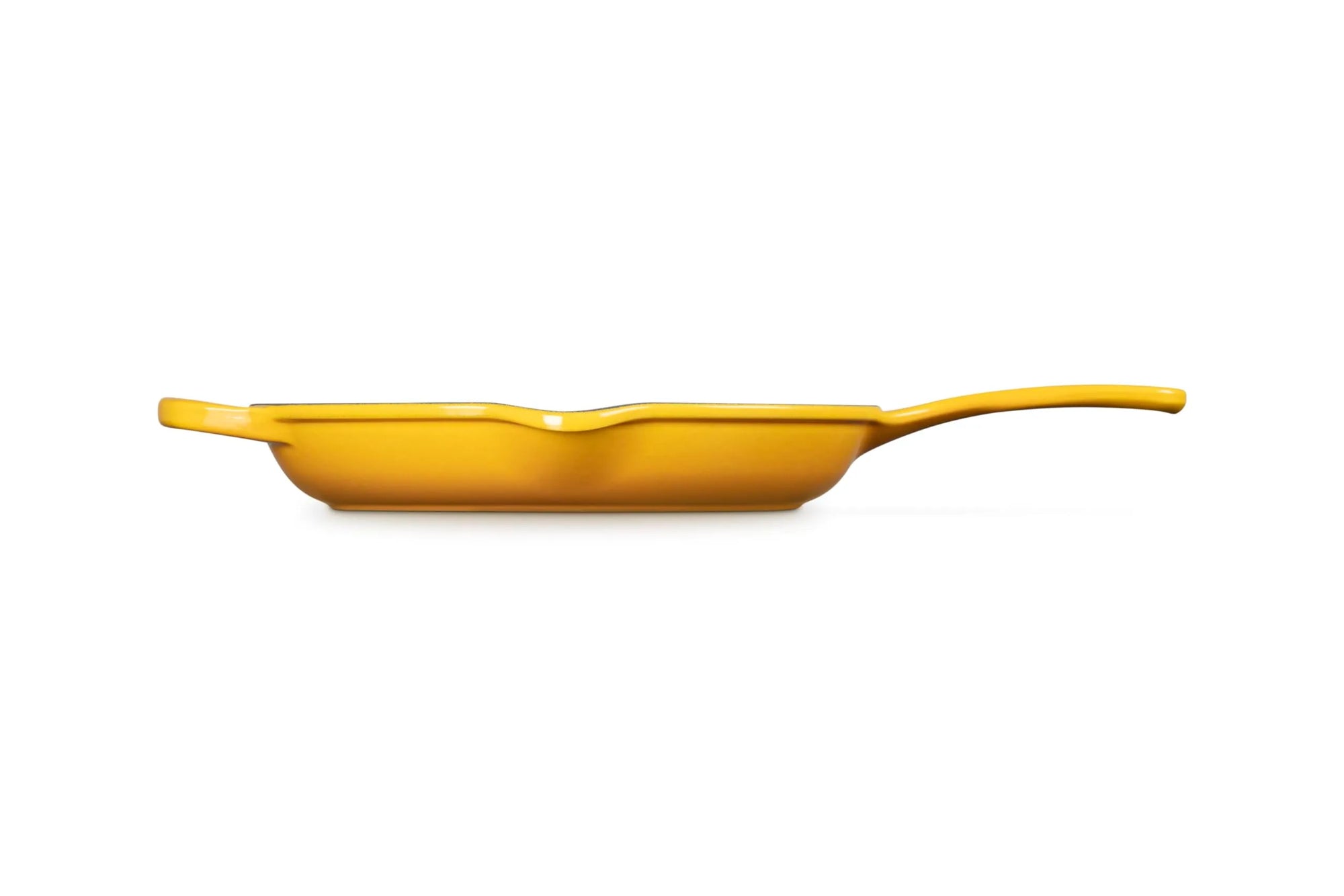 A bright yellow cast iron skillet with a single handle, shown in profile against a solid white background.
