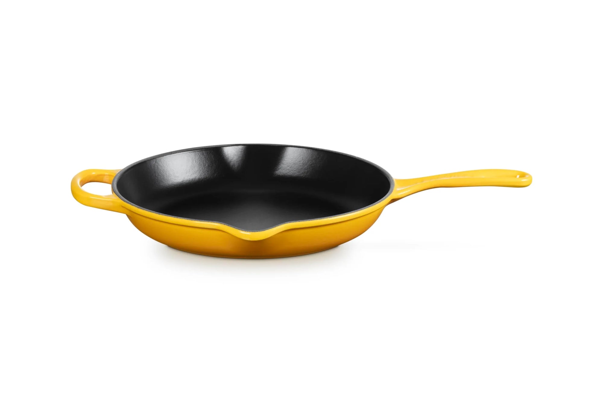 A yellow enameled cast iron skillet with a black interior, featuring a small loop handle on the left and a long straight handle on the right, shown on a solid white background.