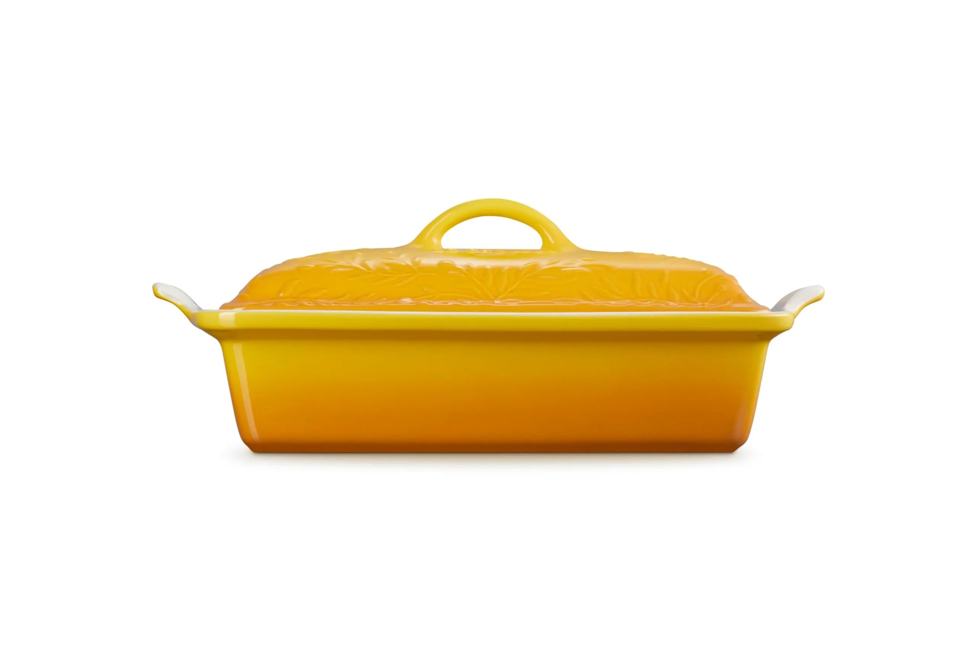 A rectangular yellow ceramic casserole dish with a matching lid, featuring side handles and a top handle, shown against a plain white background.