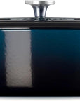 Side view of a dark teal enameled cast iron Dutch oven with a matching lid and silver knob, shown on a plain white background.