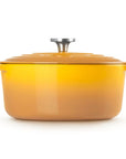 A yellow-orange enameled cast iron Dutch oven with a matching lid and side handles, shown on a clean white background.