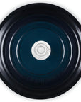 A top-down view of a dark blue enameled cast iron pot or Dutch oven with two side handles and a matching lid, set against a plain white background.