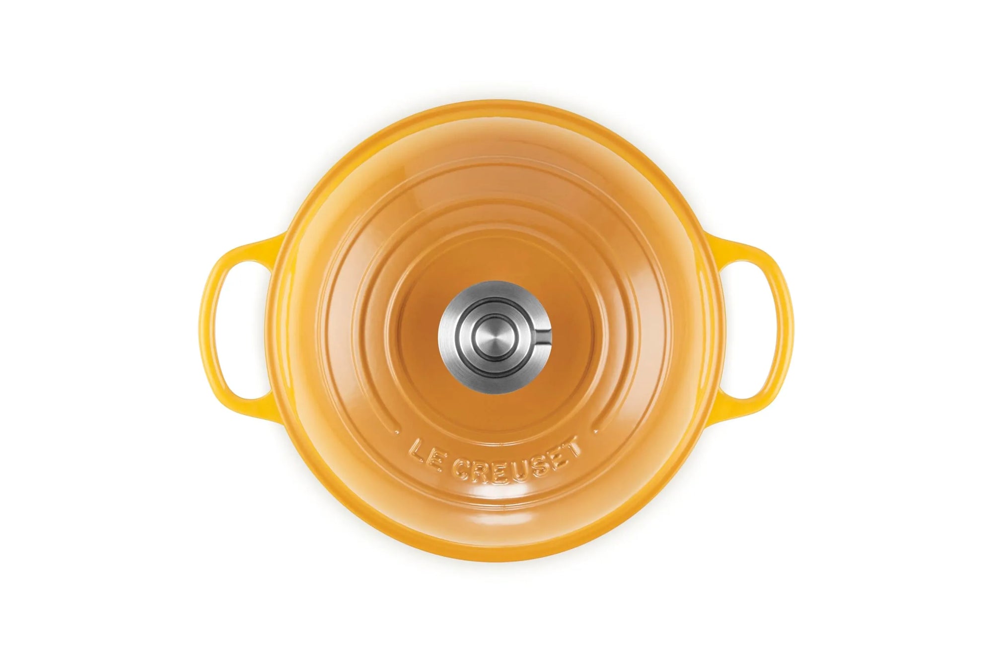 Top-down view of a Le Creuset enameled cast iron pot in a vibrant orange-yellow color, featuring two side handles and a stainless steel knob on the lid, set against a plain white background.