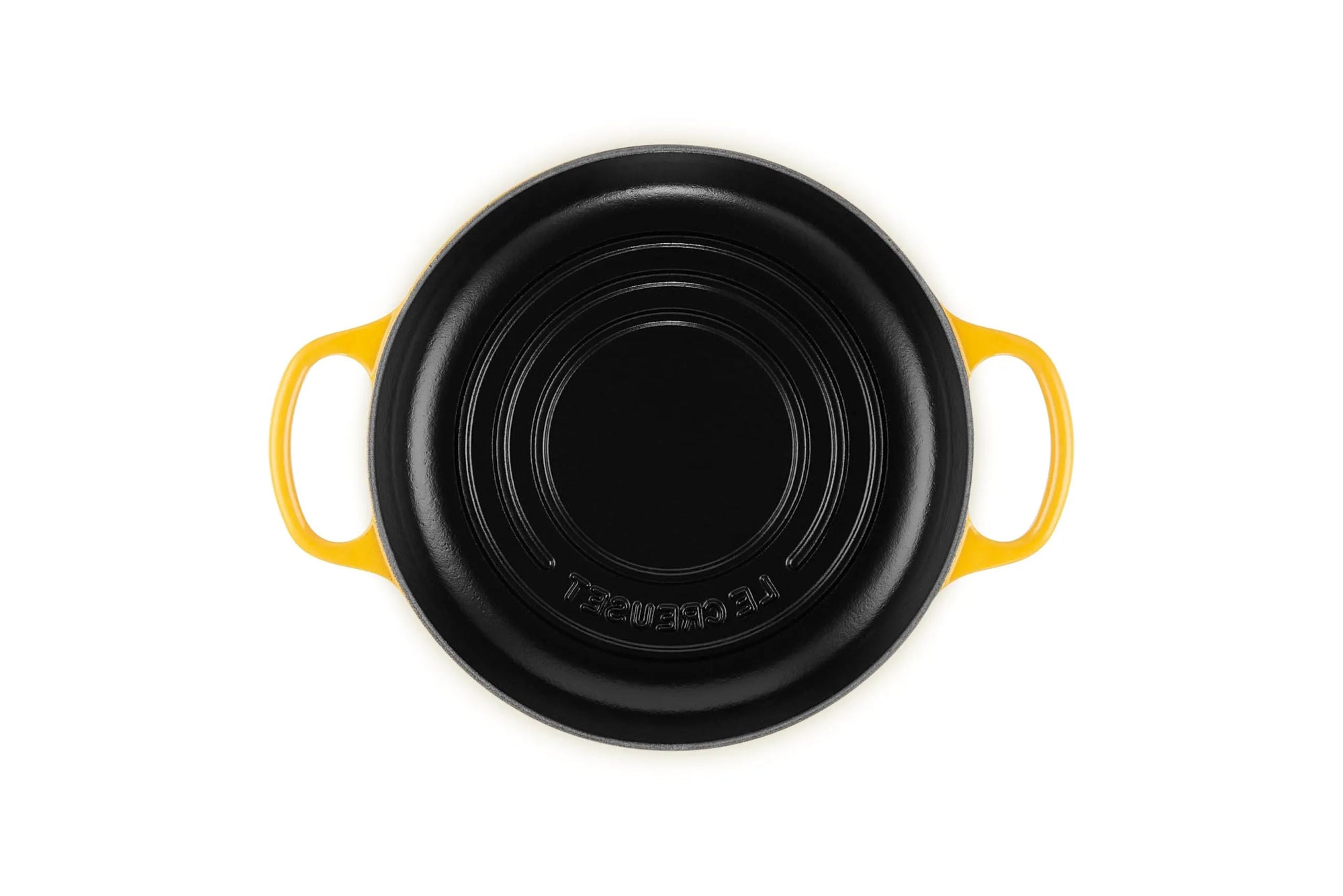 A Le Creuset black cast iron casserole dish with bright yellow handles, shown from a top-down view on a white background.
