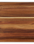Top view of wooden cutting board with a visible grain pattern on a white background