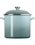 Front view of sea salt pot and sea salt lid on a white background