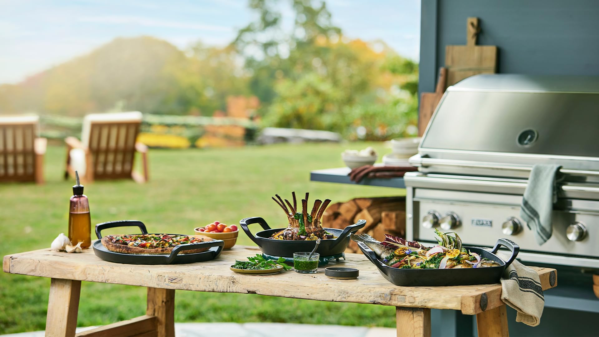 Outdoor setting with a grill, table, and food preparation area.