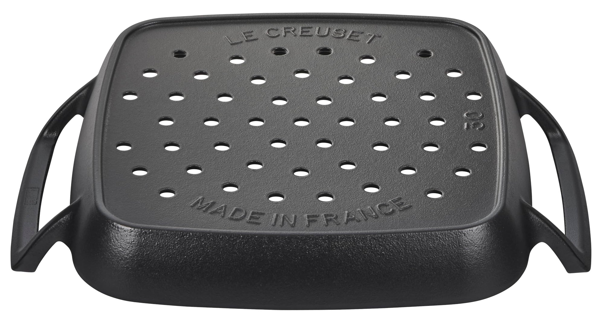 Black grill pan with handles on a white background, featuring 'Le Creuset' branding.