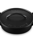Black cast iron utility pan with 'Le Creuset' branding on a white background