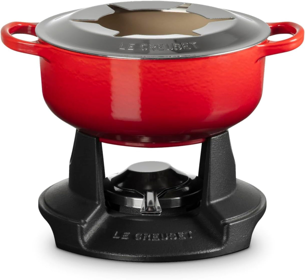 A red Le Creuset enameled cast iron pot with a matching red lid, shown on a black Le Creuset burner base against a white background.