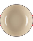 Red soup pot with light interior and handles
