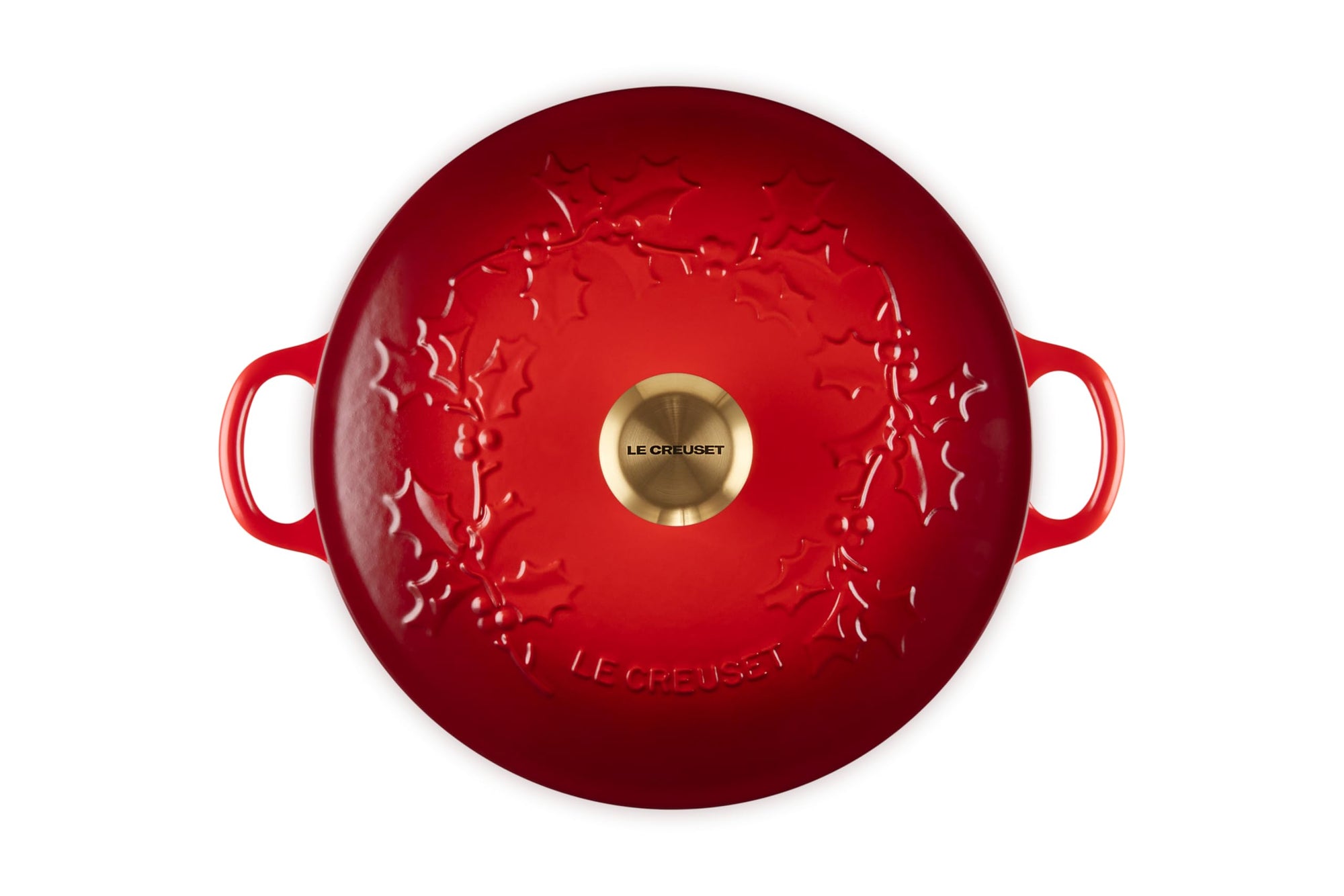 Red soup pot with leaf decoration on lid with gold knob and handles