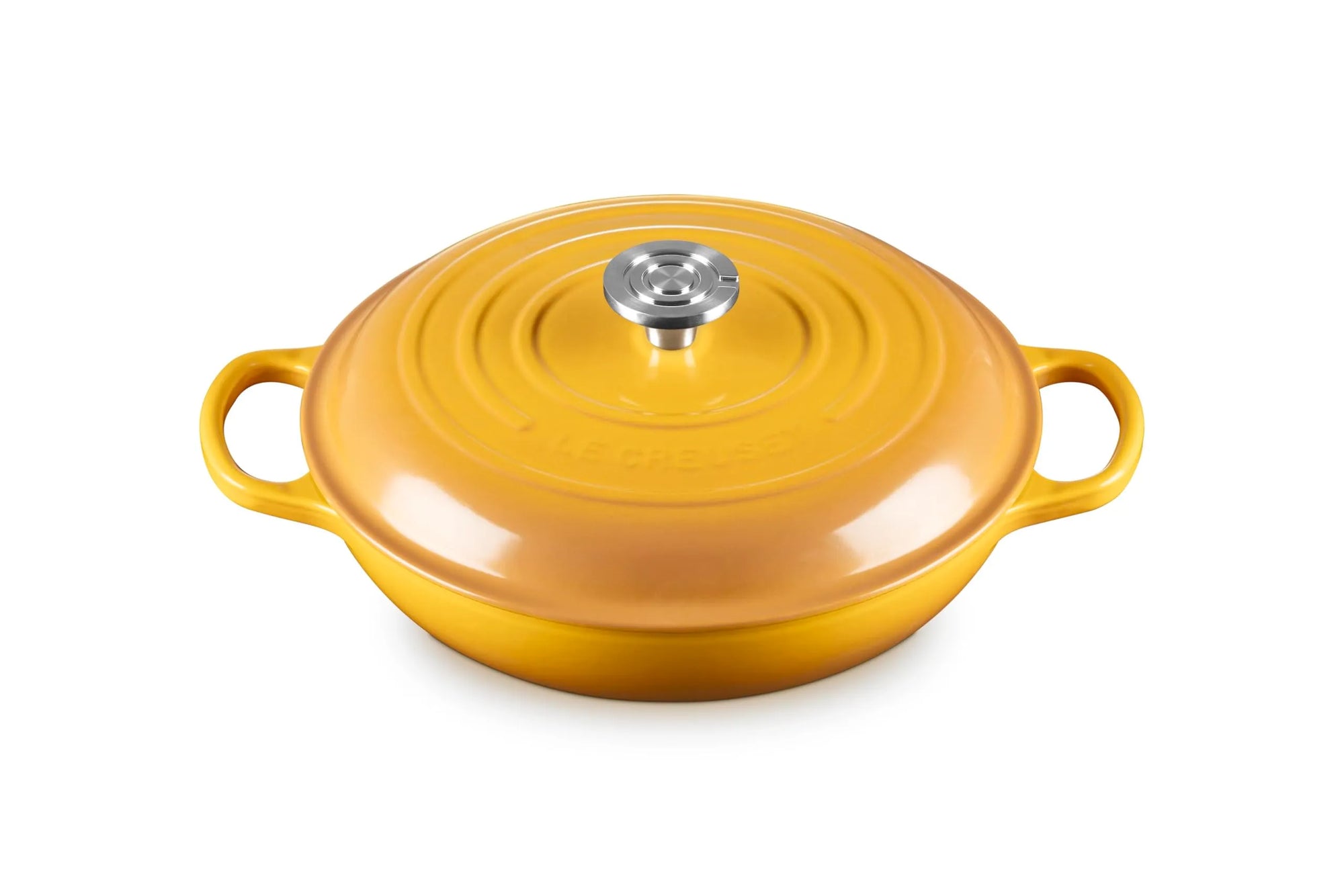 A yellow enameled cast iron Dutch oven with a matching lid and side handles, featuring a silver stainless steel knob on a white background.