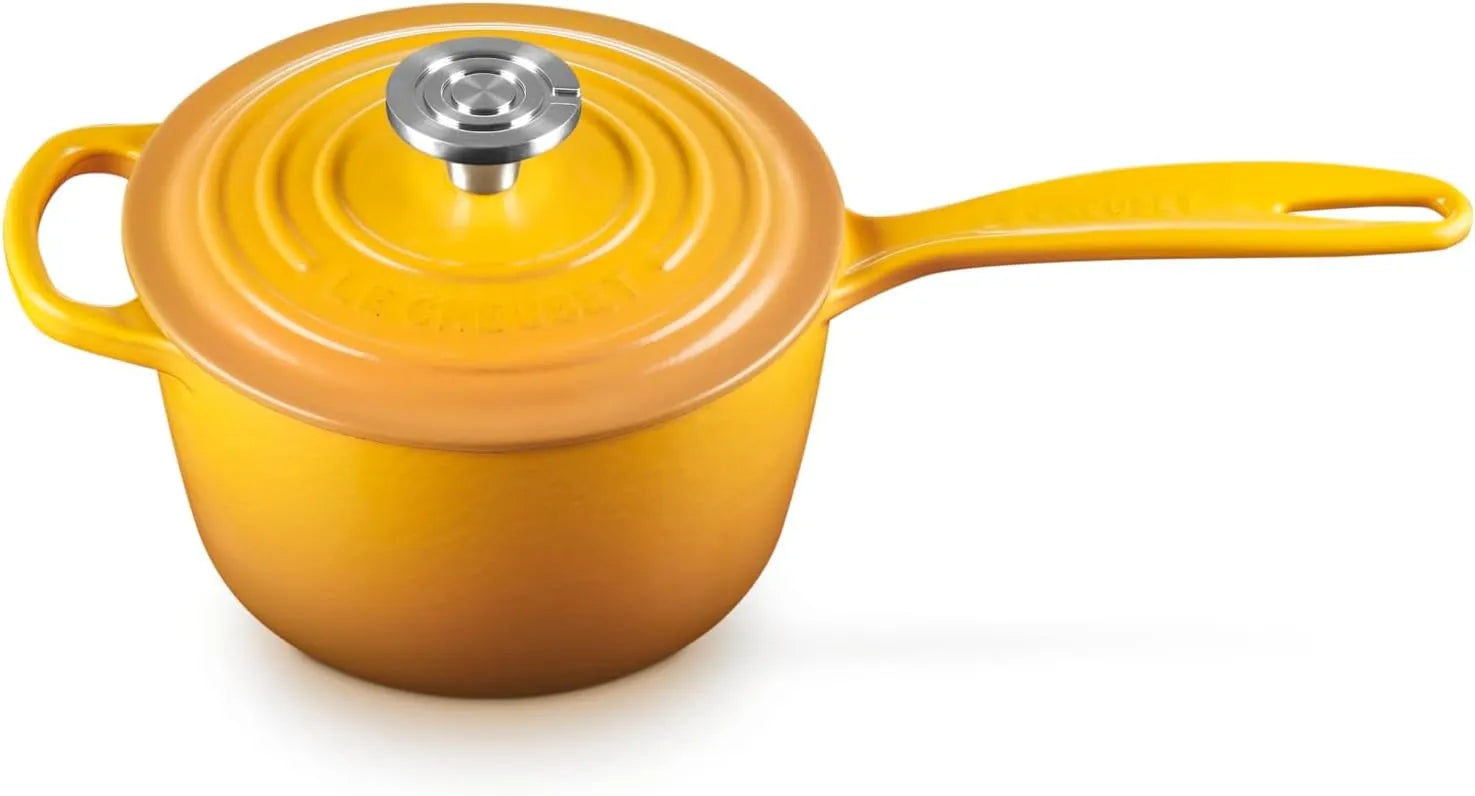 A yellow enameled cast iron saucepan with a matching lid and a silver stainless steel knob, shown on a white background.