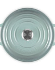 Sea salt round cast iron cookware with handles on a white background