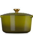 Olive enameled cast iron Dutch oven with a lid on a white background