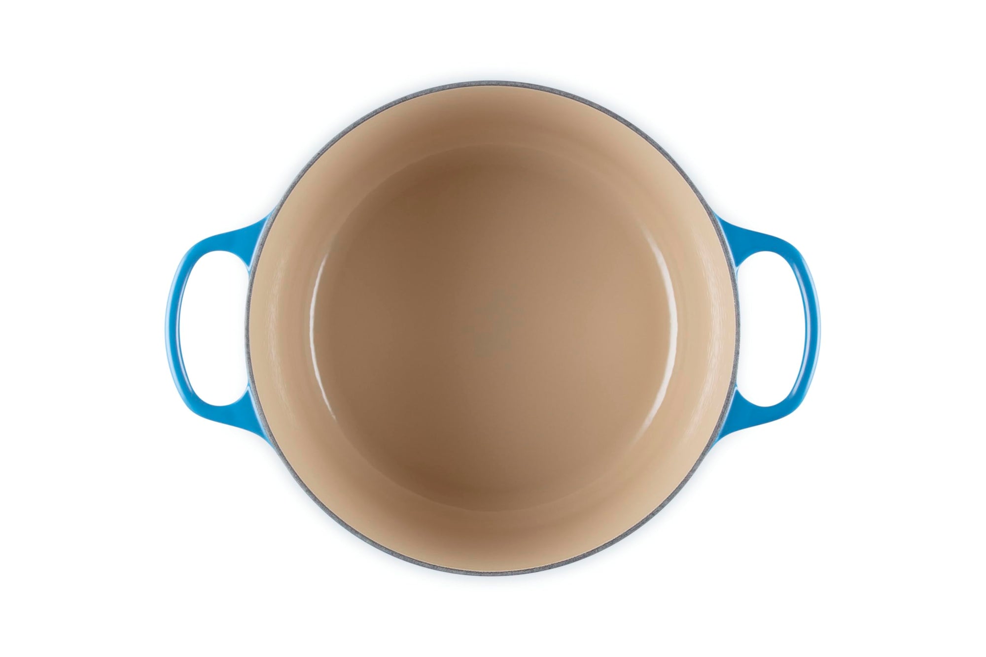 Beige enameled cast iron skillet with blue handles on a white background