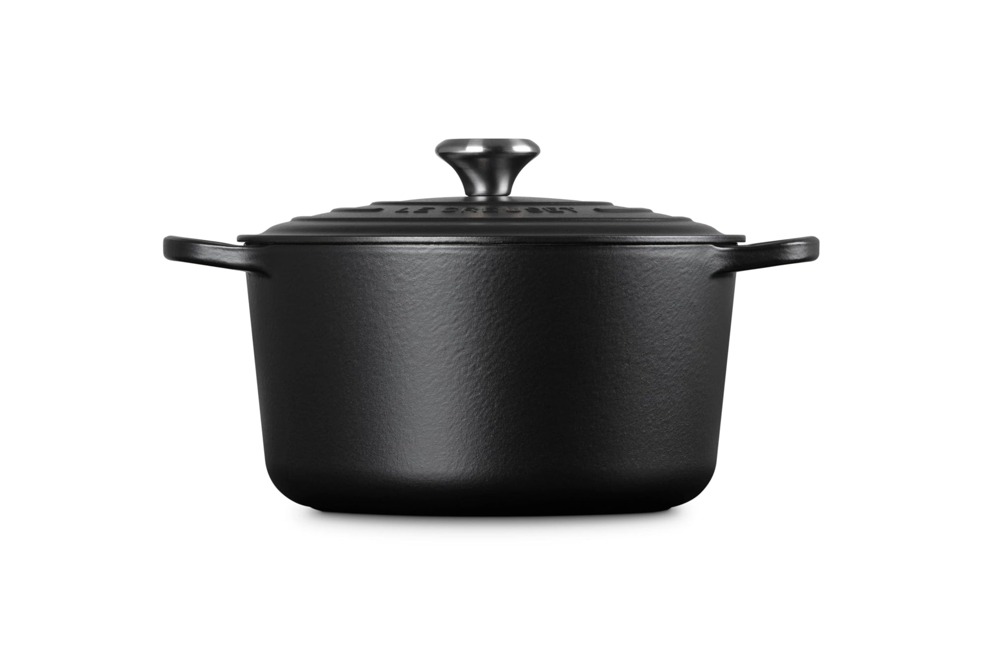 Black cast iron cookware pot with lid on a white background