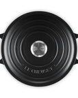 Black round Le Creuset cookware on a white background