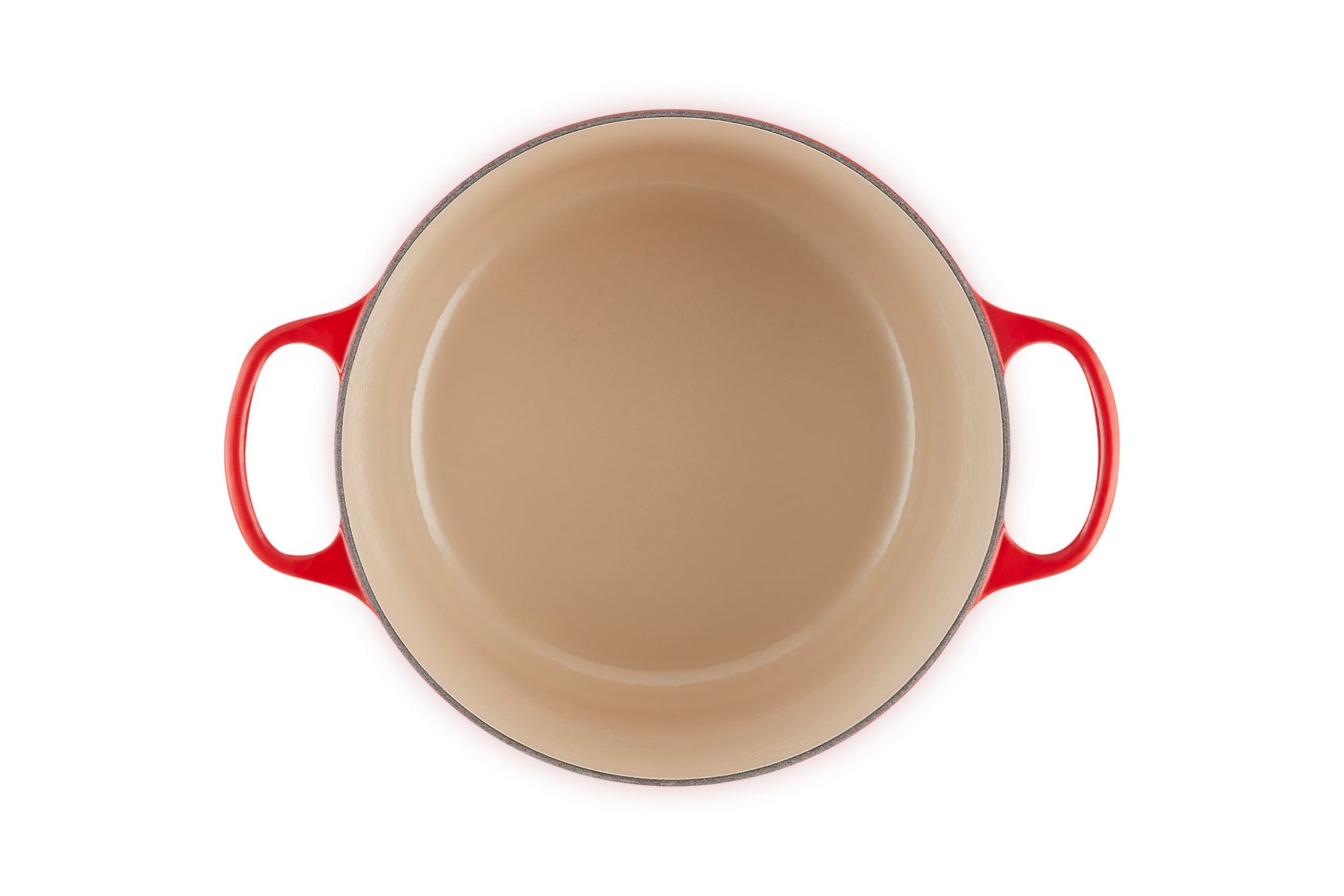 Beige frying pan with red handles on a white background