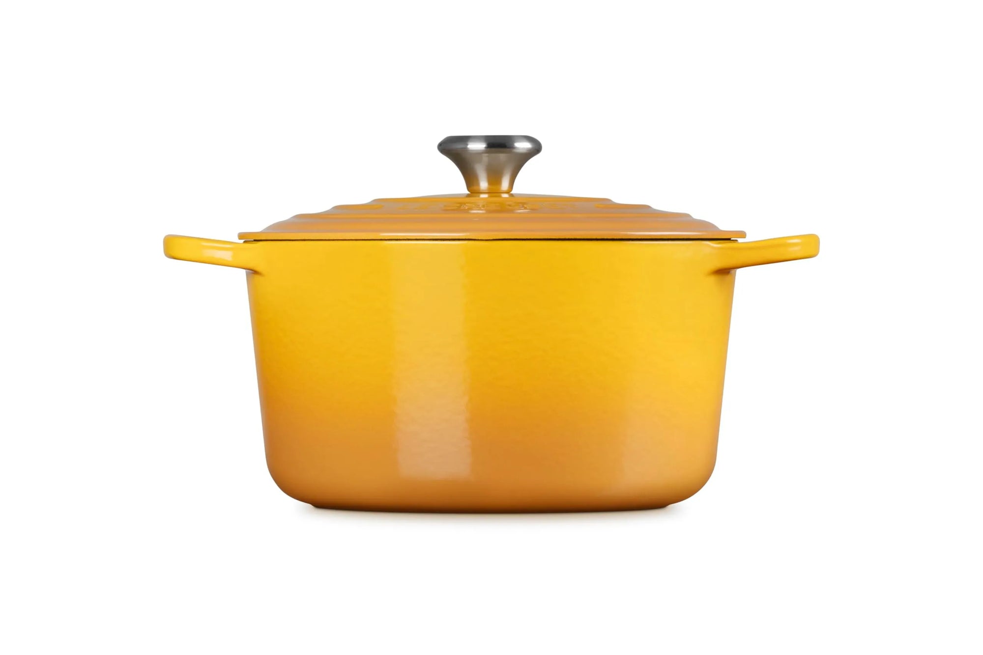 A yellow enameled cast iron Dutch oven with a matching lid and side handles, featuring a silver metal knob on top, set against a plain white background.