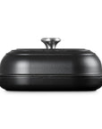 Side view of Licorice bread oven pan with lid and handles displayed on a white background