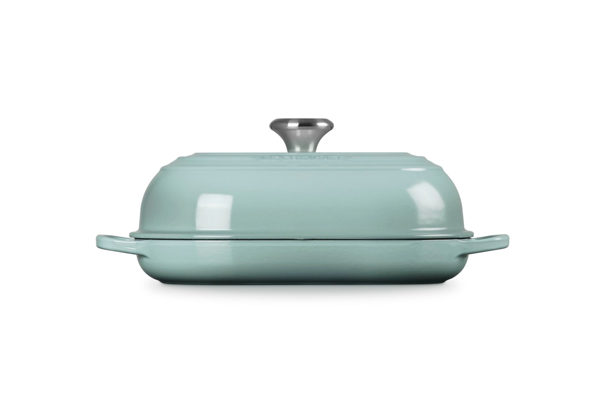 Side view of Seasalt bread oven pan with lid and handles displayed on a white background