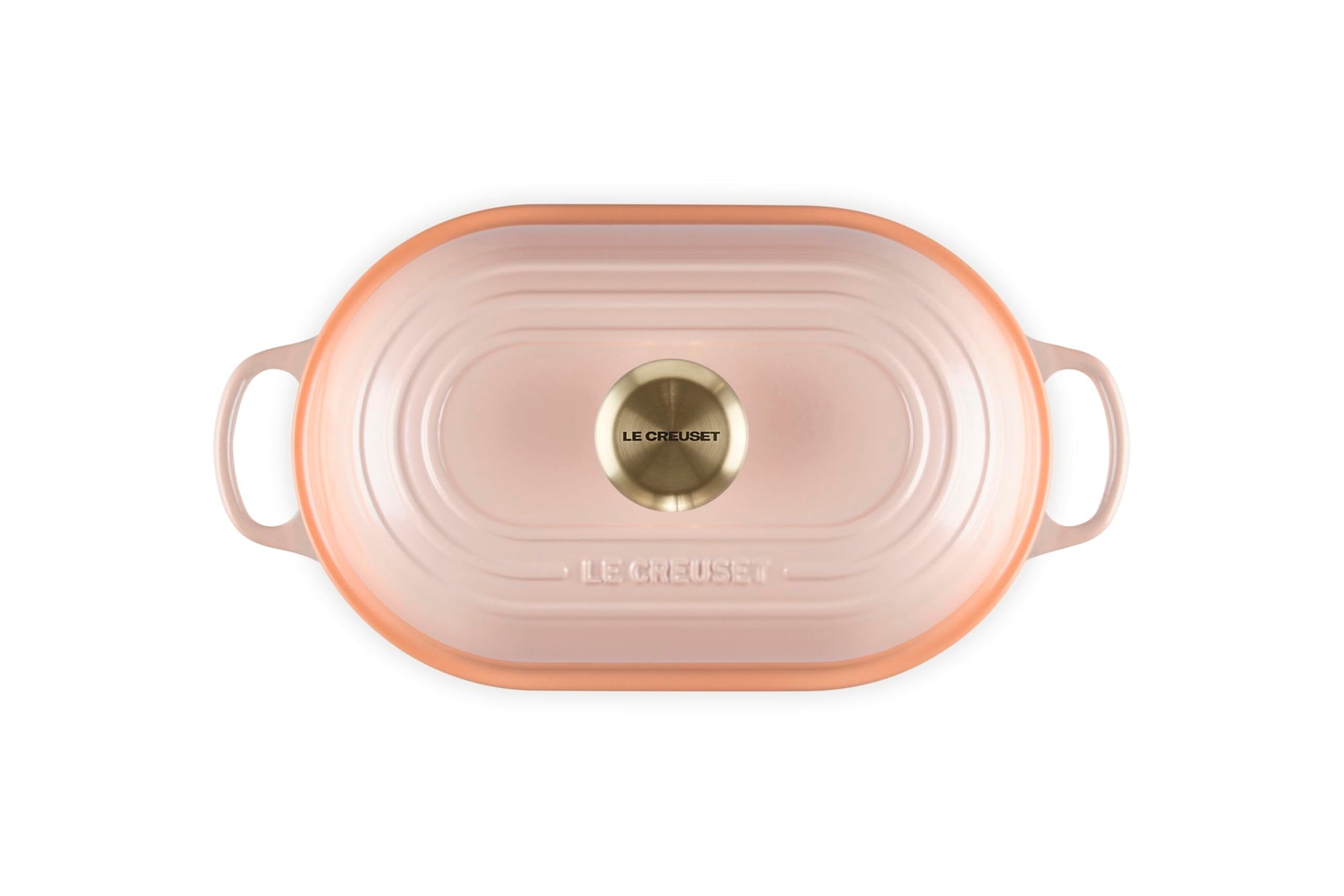 Top view of Peche bread oven pan with lid and handles displayed on a white background