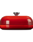 Side view of Cerise bread oven pan with lid and handles displayed on a white background