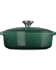 Side view of 3.5 qt artichaut Le Creuset Signature Round Wide Dutch Oven with a lid displayed on a white background