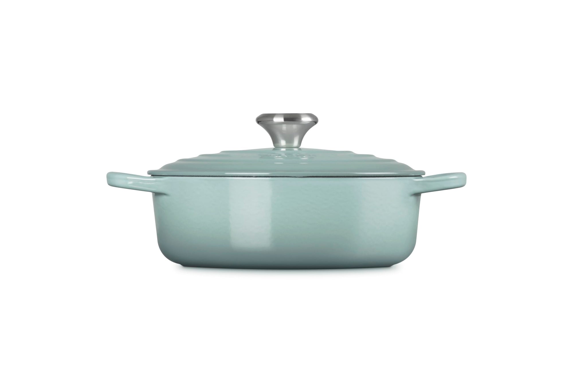 Side view of 3.5 qt Sea salt Le Creuset Signature Round Wide Dutch Oven with a lid displayed on a white background