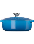 Side view of 3.5 qt Marseille Le Creuset Signature Round Wide Dutch Oven with a lid displayed on a white background