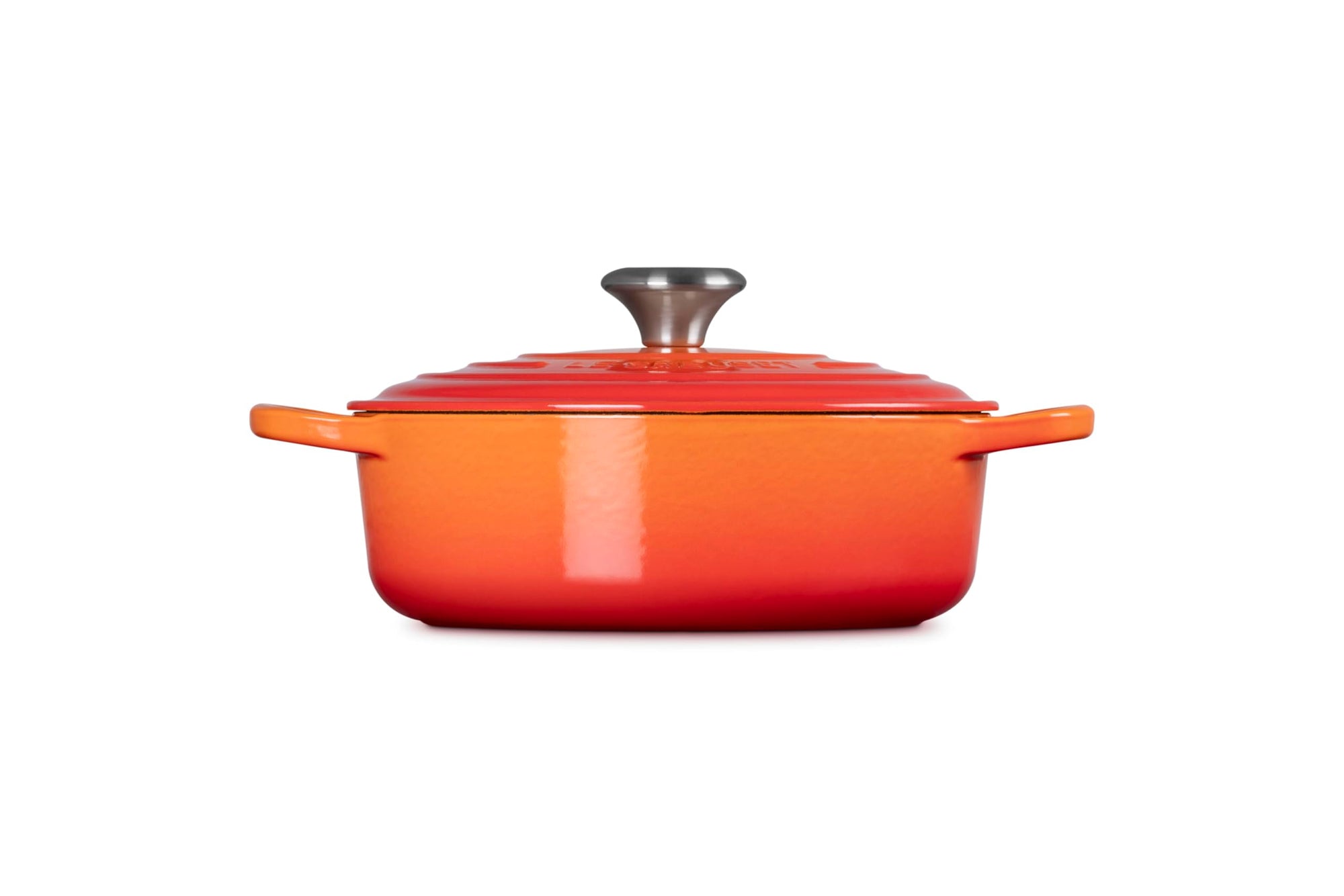 Side view of 3.5 qt flame Le Creuset Signature Round Wide Dutch Oven with a lid displayed on a white background