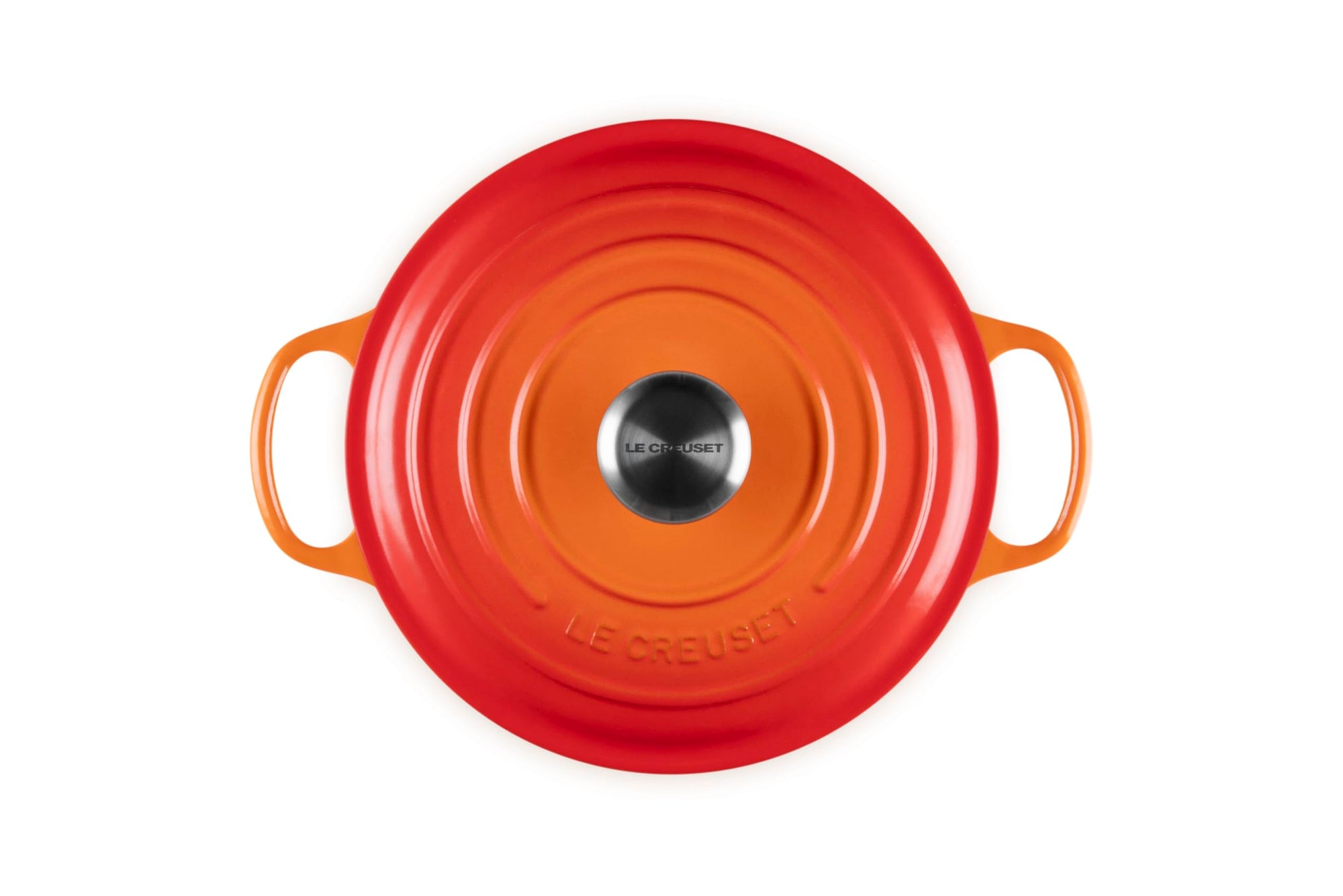 Top view of 3.5 qt flame Le Creuset Signature Round Wide Dutch Oven with a lid displayed on a white background