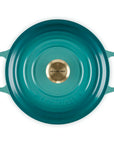 Top view of 3.5 qt riviera Le Creuset Signature Round Wide Dutch Oven with a lid displayed on a white background