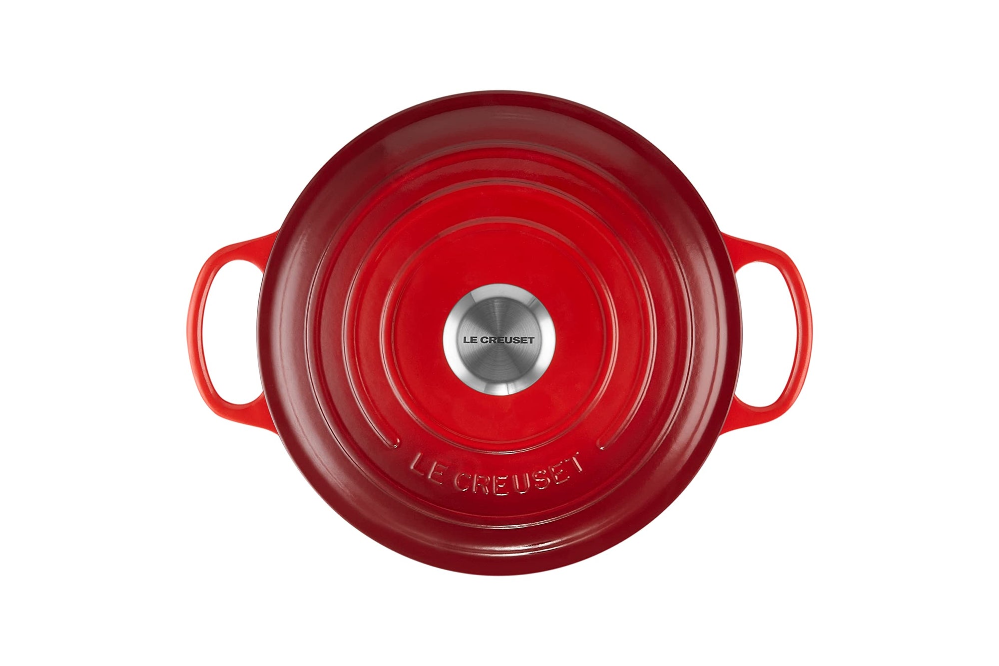 Top view of 3.5 qt cerise Le Creuset Signature Round Wide Dutch Oven with a lid displayed on a white background