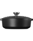 Side view of 3.5 qt Licorice Le Creuset Signature Round Wide Dutch Oven with a lid displayed on a white background
